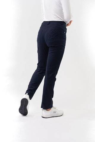 Navy Ladies golf trousers made from flexible lightweight 4 way stretch material.  Featuring a zip and button fastening with five belt loops, a regular fit with anti-crease and anti-static properties. These women's golf trousers have two open pockets to the front and back. Size 8 to 20.