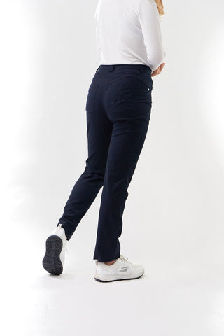 Navy Ladies golf trousers made from flexible lightweight 4 way stretch material.  Featuring a zip and button fastening with five belt loops, a regular fit with anti-crease and anti-static properties. These women's golf trousers have two open pockets to the front and back. Size 8 to 20.