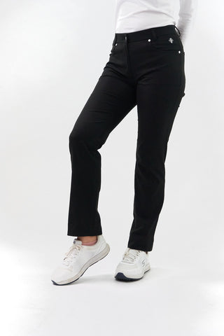 Black ladies golf trousers made from flexible lightweight 4 way stretch material.  Featuring a zip and button fastening with five belt loops, a regular fit with anti-crease and anti-static properties. These women's golf trousers have two open pockets to the front and back. Size 8 to 20.