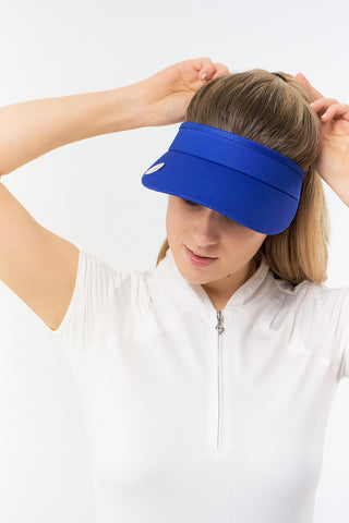 Royal Blue  ladies golf visor constructed with quick-drying fabrics. The visor comes in a one size fits all design with an elasticated cord at the rear to hold it securely in place. It also features a concealed magnet  in peak with a hand enamelled lace golf ball marker attached, making it a lovely golf accessory, golf gift! The headband features a soft lined absorbent towel. 