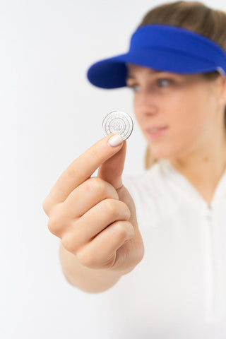 Royal Blue  ladies golf visor constructed with quick-drying fabrics. The visor comes in a one size fits all design with an elasticated cord at the rear to hold it securely in place. It also features a concealed magnet  in peak with a hand enamelled lace golf ball marker attached, making it a lovely golf accessory, golf gift! The headband features a soft lined absorbent towel. 