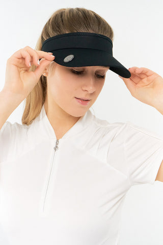 Black ladies golf visor constructed with quick-drying fabrics. The visor comes in a one size fits all design with an elasticated cord at the rear to hold it securely in place. It also features a concealed magnet  in peak with a hand enamelled lace golf ball marker attached, making it a lovely golf accessory, golf gift! The headband features a soft lined absorbent towel. 