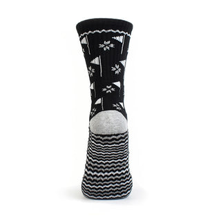 Ladies Black Crew Golf Sock has a trendy golf flag design with lurex stripe detailing on the sole. Made from a soft, stretchy cotton blend fabric allowing breathability, with a cushioned sole, compression fit and Rib cuff for a snug fit. They are suited to UK sizes between 4 and 7. 85% Cotton, 13% Polyester, 2% Elastane.